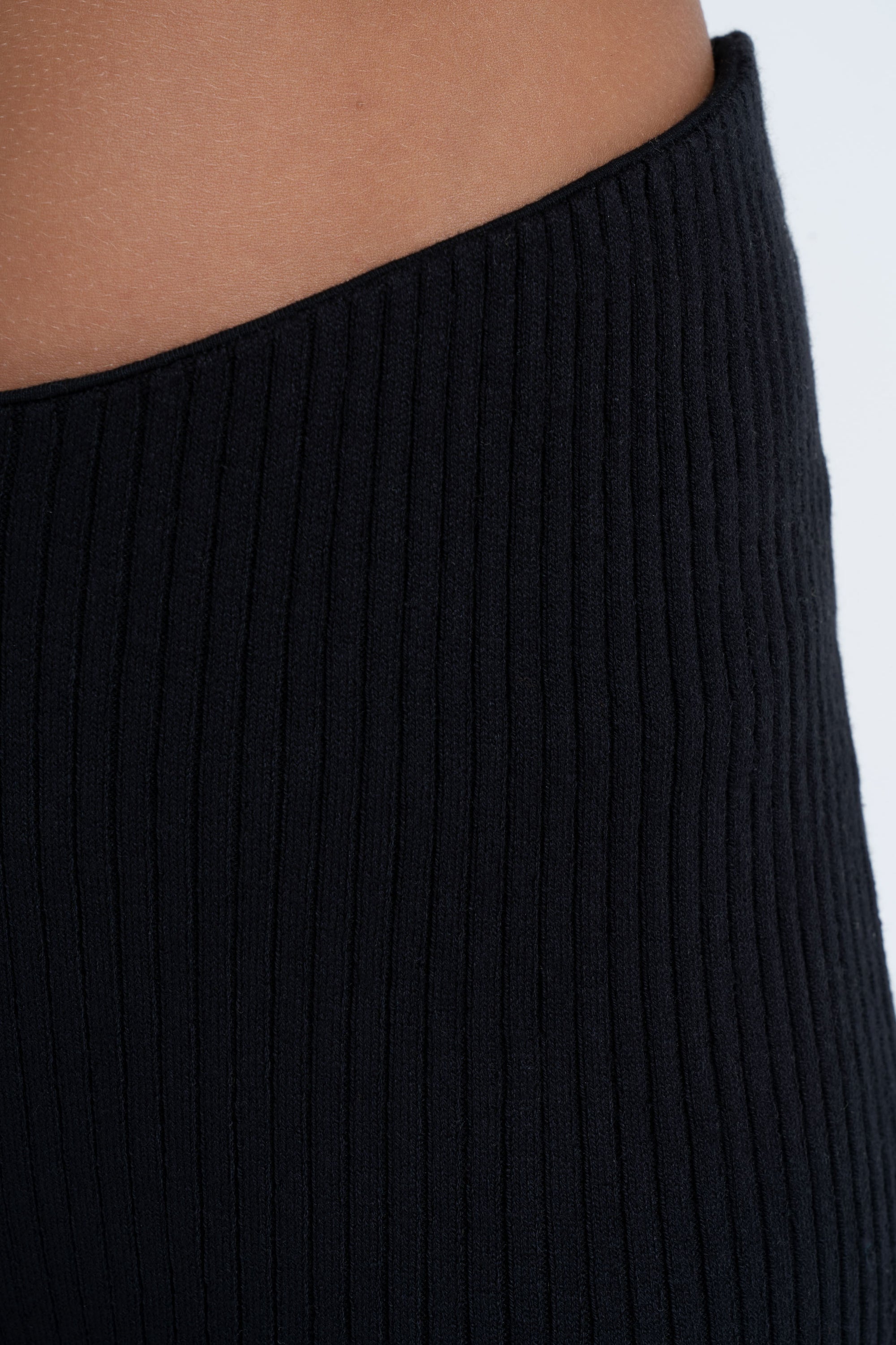 Arthur Apparel Black High-Rise Fitted Cropped Pant with Slight Handkerchief Hem in Cotton Rib Knit